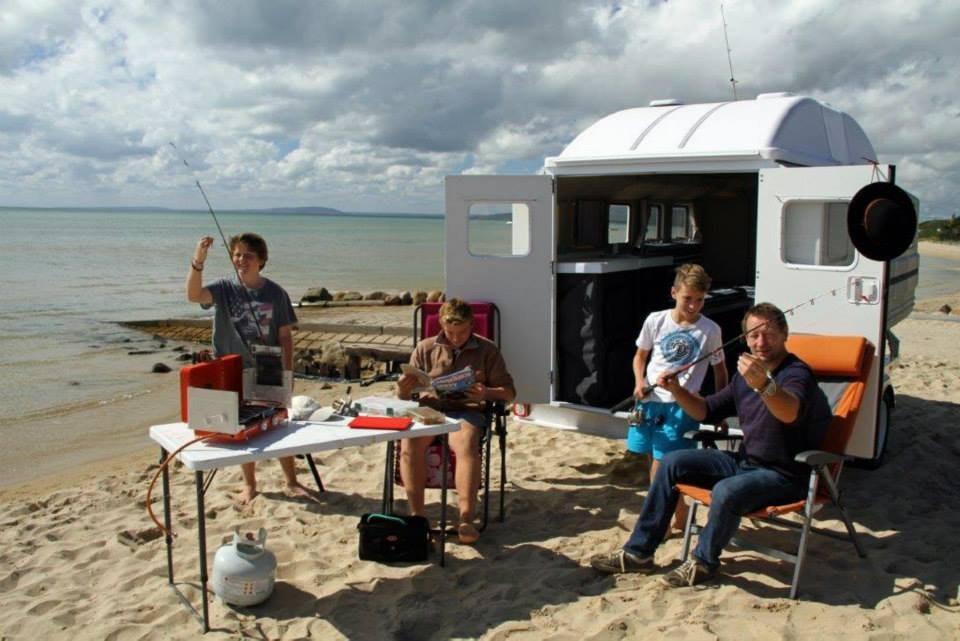 family with a caravan - Tailfeather Camping on Bach