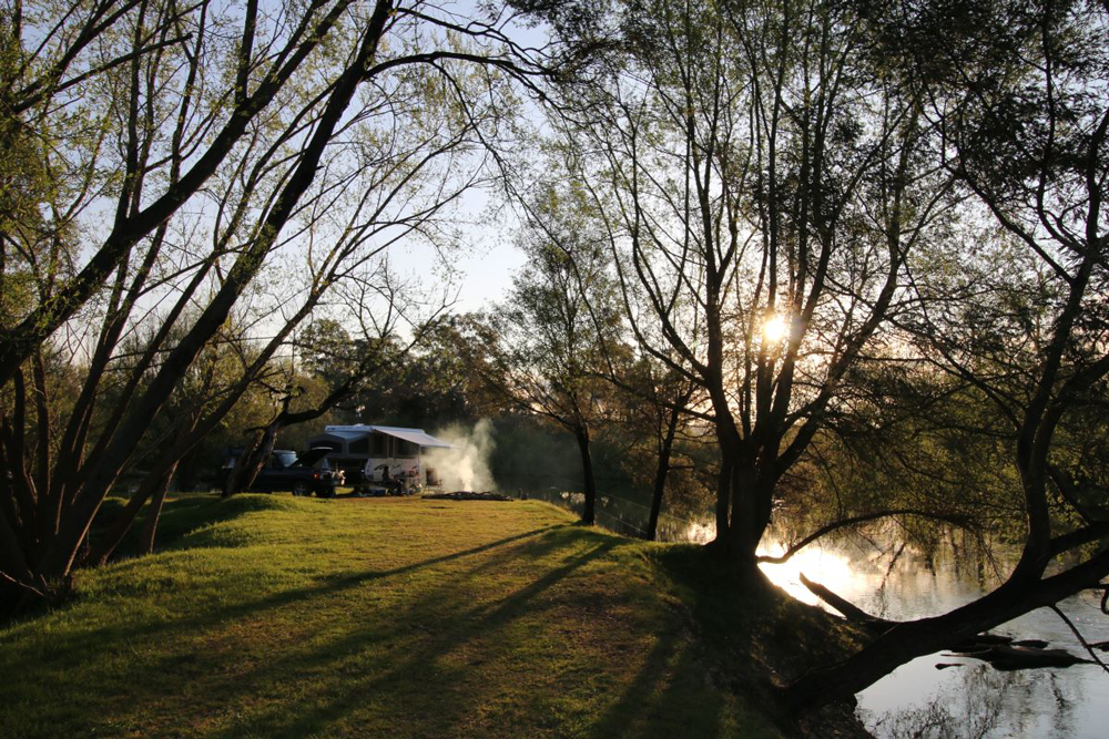 Camper trailer on river