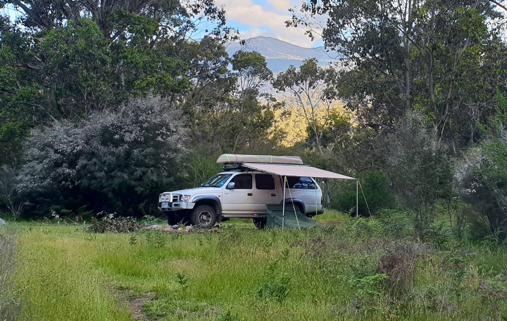 Car with kayak, awning and swag