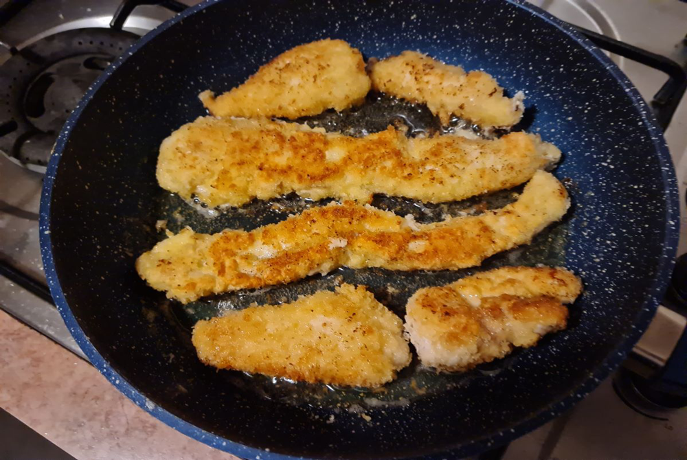 fish cooking in a frypan 