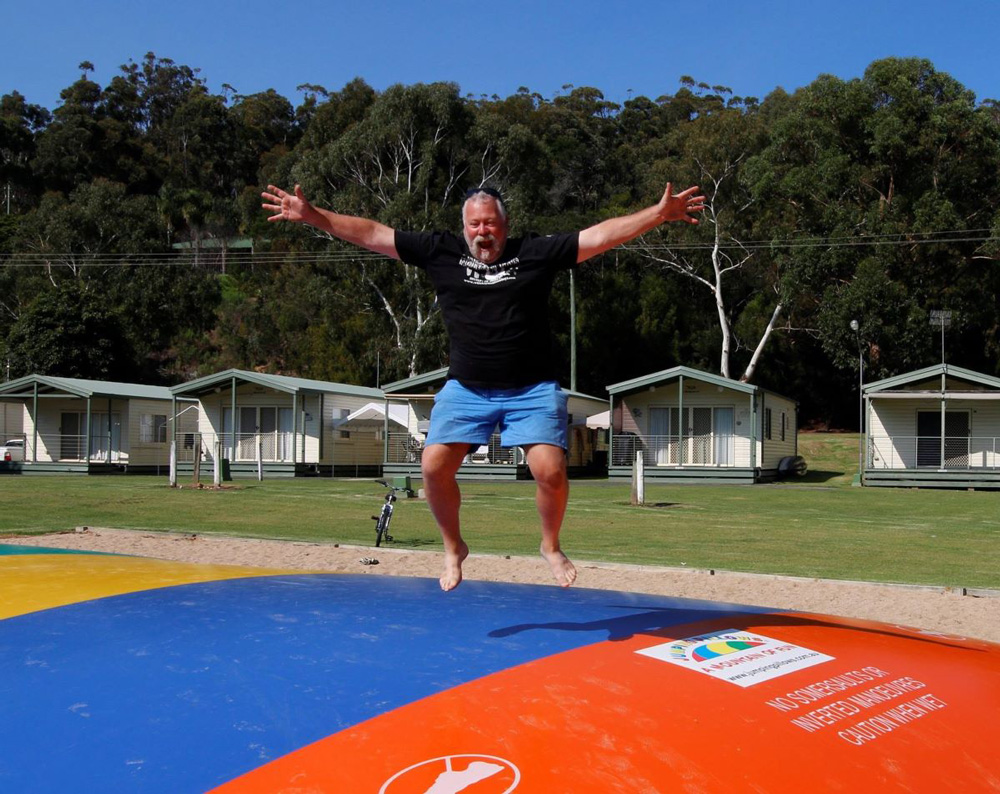 Silly man on jumping pad