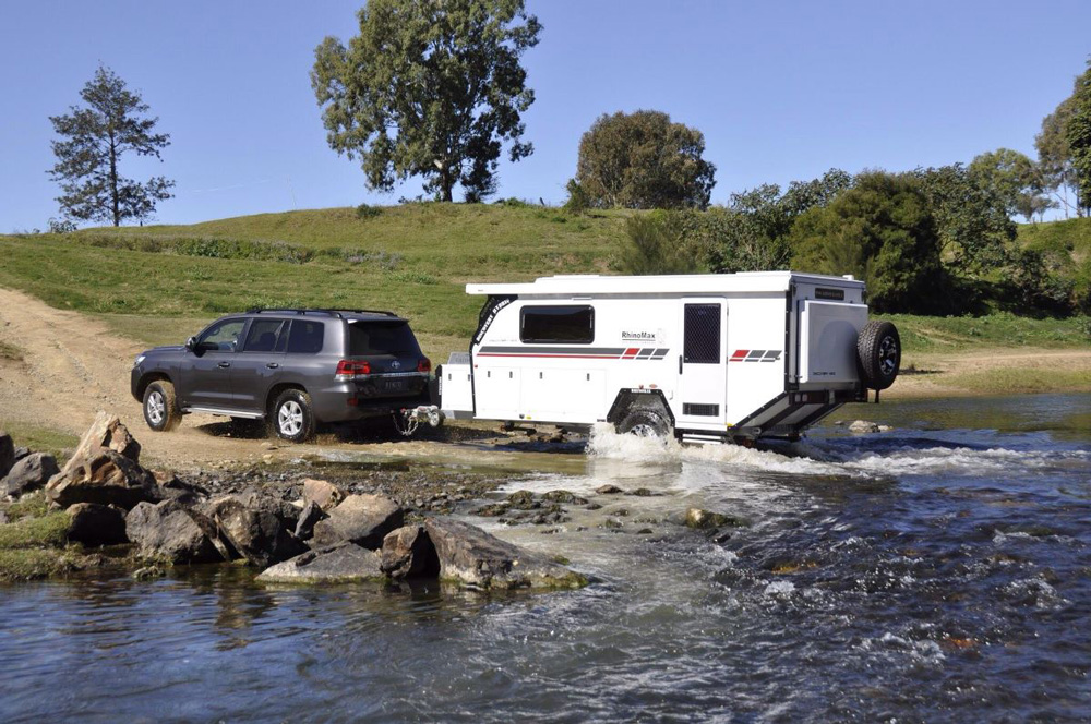 Car towing a Rhinomax camper trailer